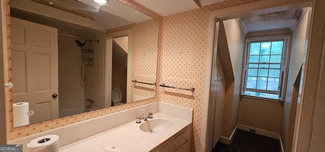 a bathroom with a toilet and a sink