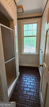 a bathroom with a tub and a sink