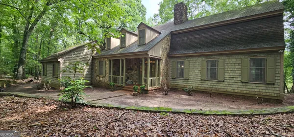 a kitchen with stainless steel appliances wooden cabinets and a stove top oven