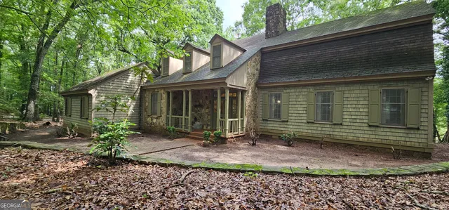 a kitchen with stainless steel appliances wooden cabinets and a stove top oven