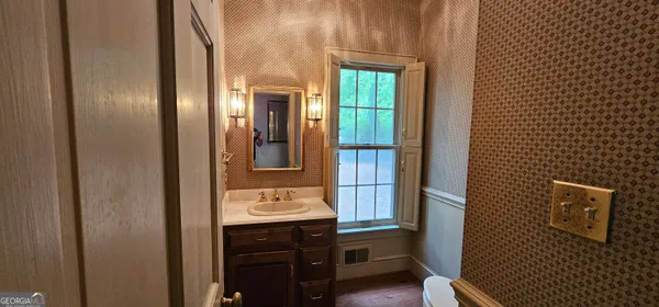 a bathroom with a sink and a mirror