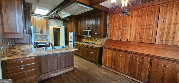 a view of a livingroom with furniture window and wooden floor