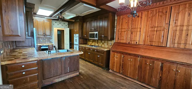 a view of a livingroom with furniture window and wooden floor