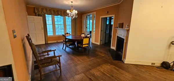 a living room with a fireplace and a table
