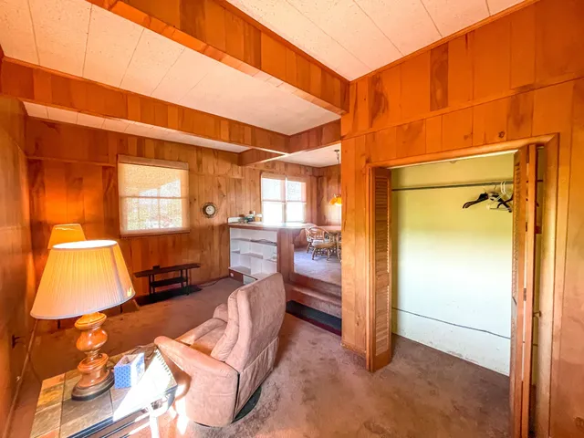 a view of living room with furniture and a window
