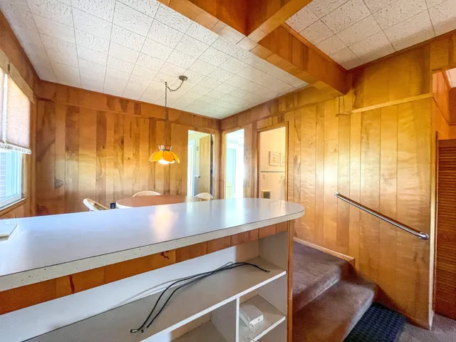 a view of kitchen with furniture and large window