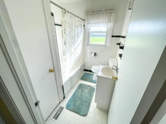 a bathroom with sink and mirror