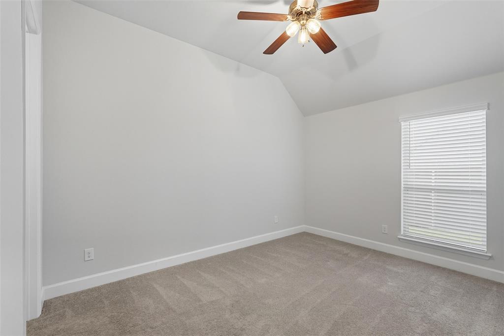 1557 Ripasso Way McLendon-Chisholm, TX 75032 - Photo 21 of 31 an empty room with a window and a ceiling fan