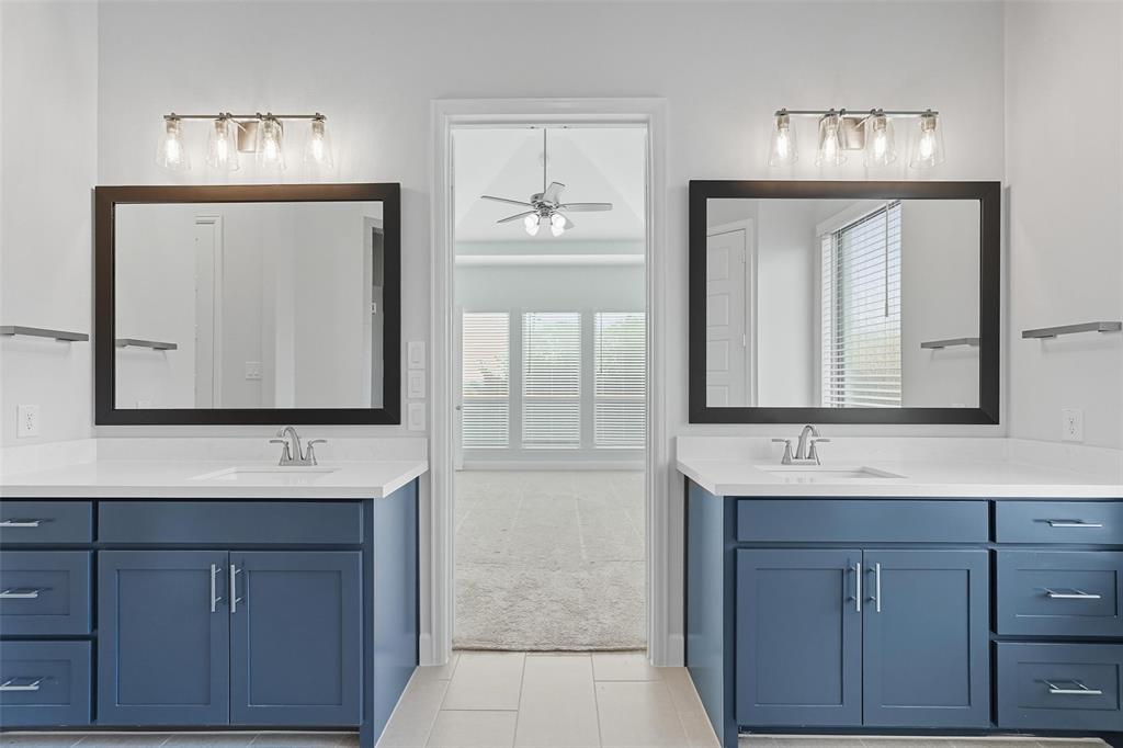1557 Ripasso Way McLendon-Chisholm, TX 75032 - Photo 26 of 31 a bathroom with a sink vanity and a mirror