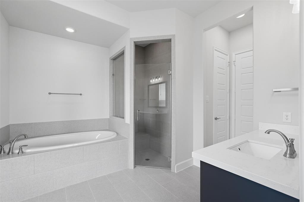 1557 Ripasso Way McLendon-Chisholm, TX 75032 - Photo 27 of 31 a bathroom with a bathtub and sink