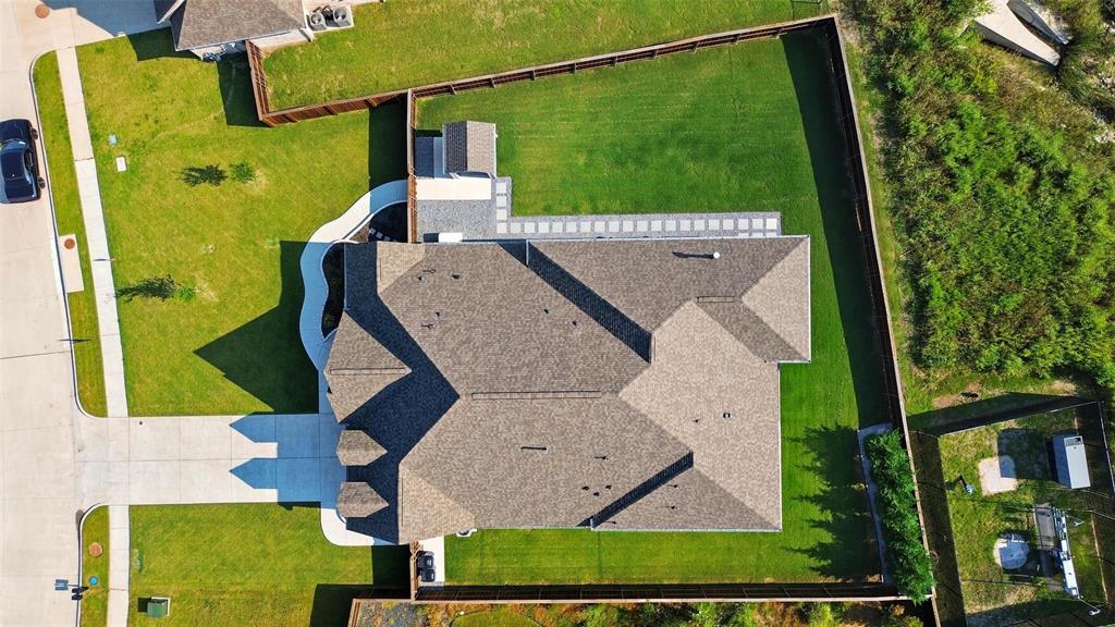 1557 Ripasso Way McLendon-Chisholm, TX 75032 - Photo 30 of 31 an aerial view of a house with a yard