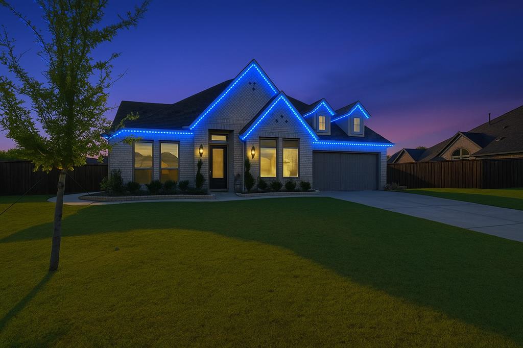 1557 Ripasso Way McLendon-Chisholm, TX 75032 - Photo 31 of 31 a front view of a house with a garden and yard