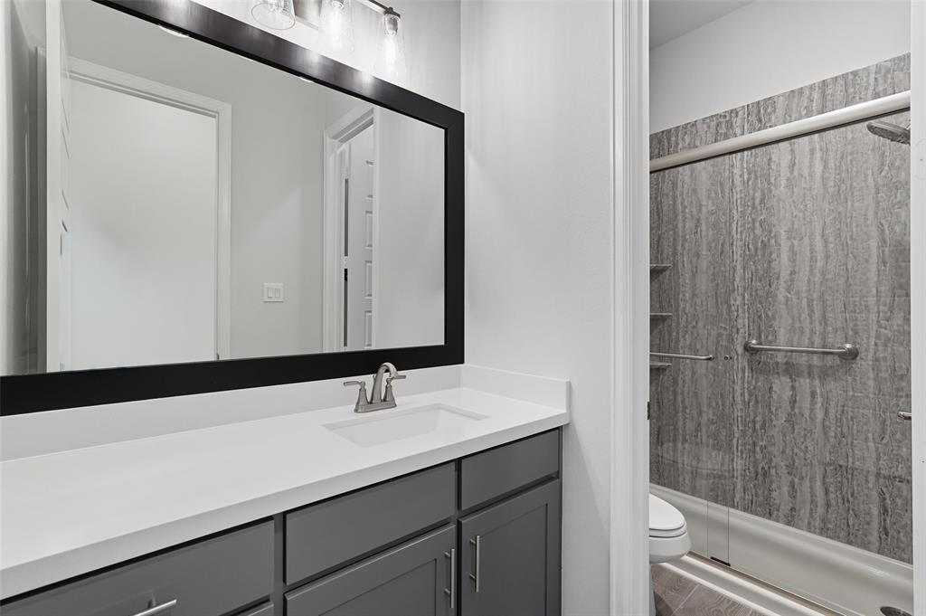 1557 Ripasso Way McLendon-Chisholm, TX 75032 - Photo 5 of 31 a bathroom with a sink and a mirror