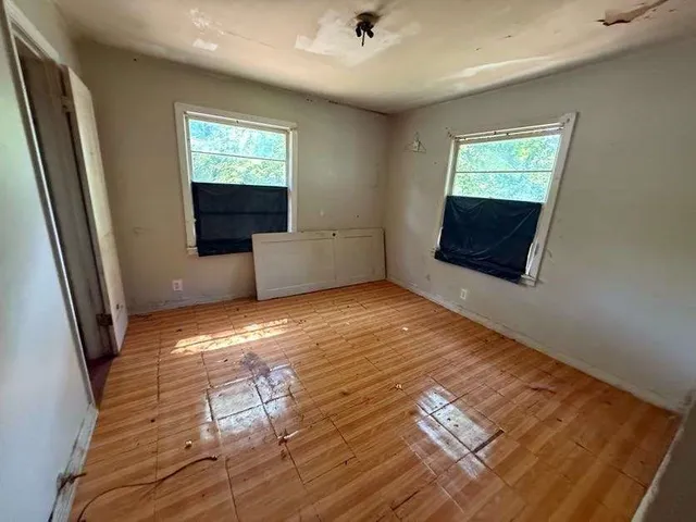 a view of livingroom with furniture wooden floor and window
