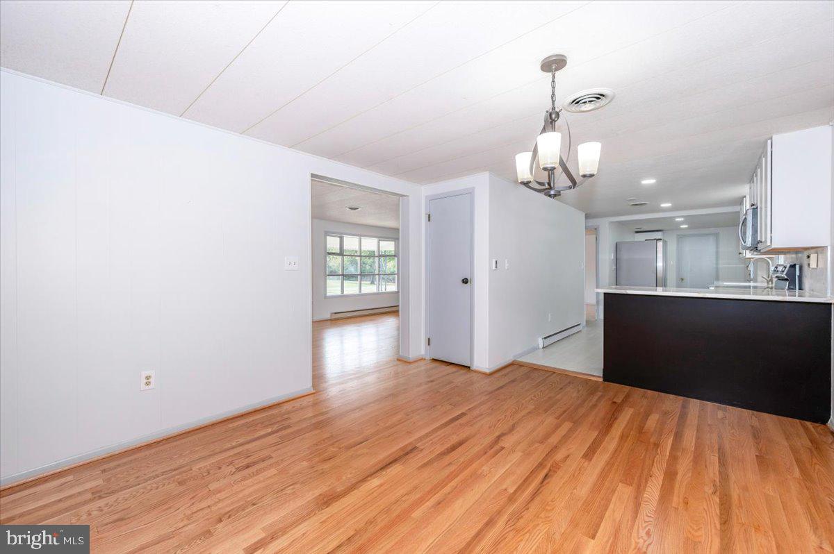 6 Schaller Lane Smithsburg, MD 21783 - Photo 14 of 51 a bedroom with a bed and painting on the wall