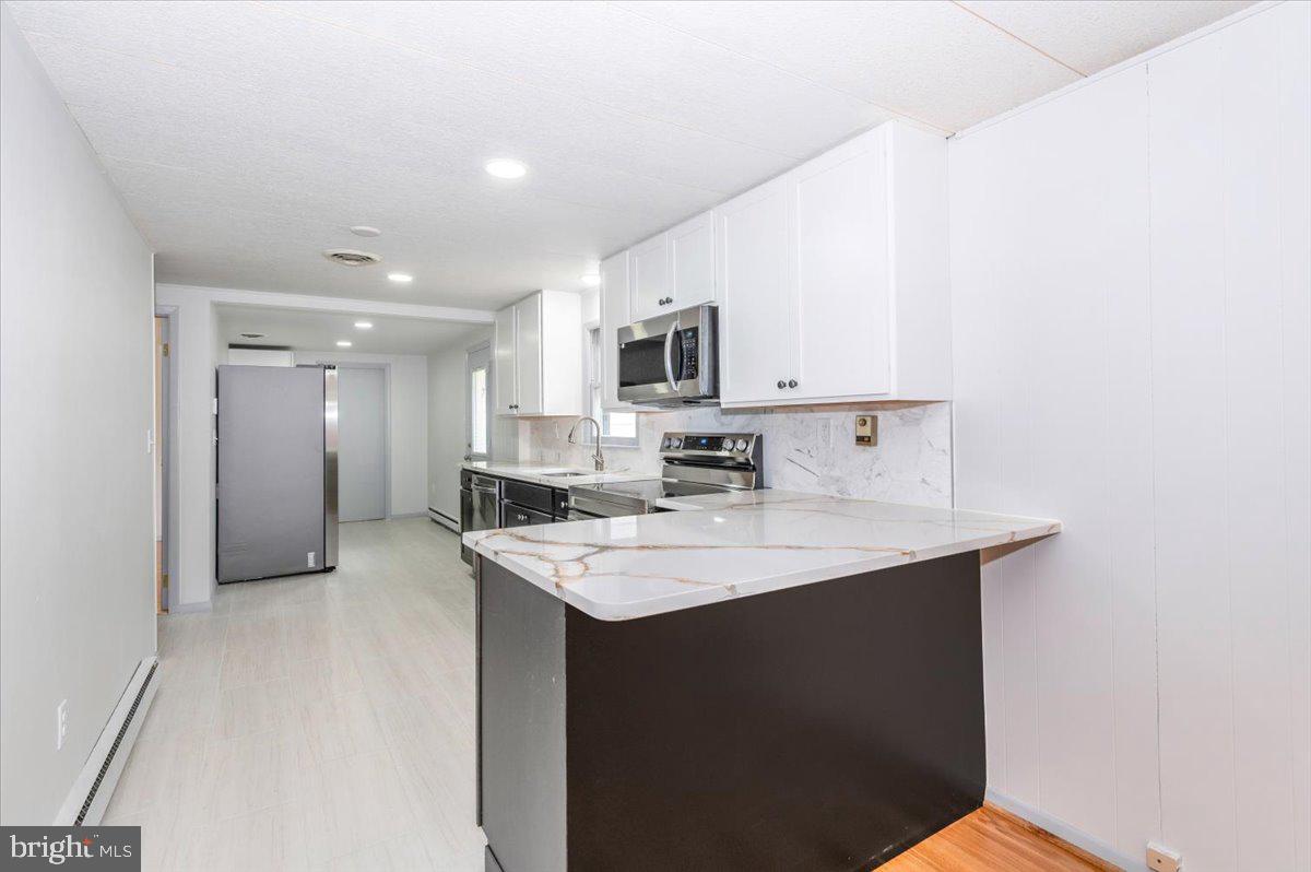 6 Schaller Lane Smithsburg, MD 21783 - Photo 16 of 51 a kitchen with a sink a counter top space and cabinets