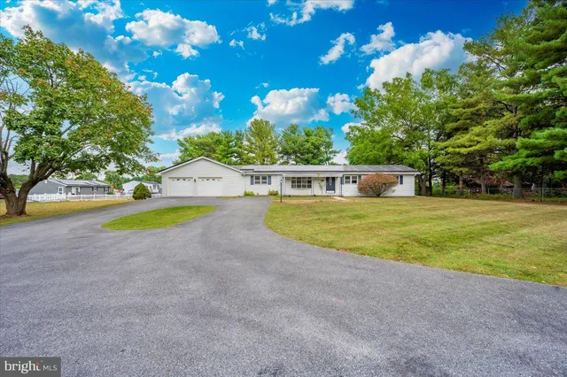 a view of a swimming pool with an outdoor space and seating area