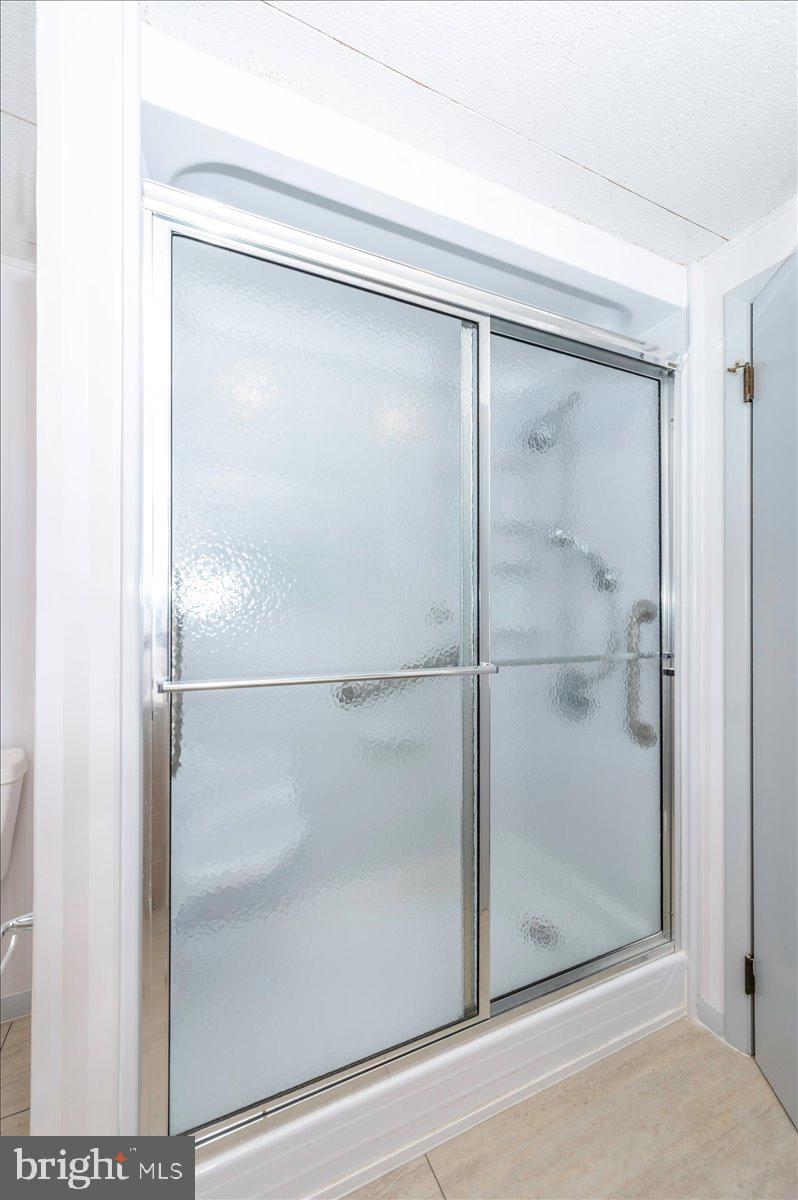 6 Schaller Lane Smithsburg, MD 21783 - Photo 36 of 51 a bathroom with a glass shower door