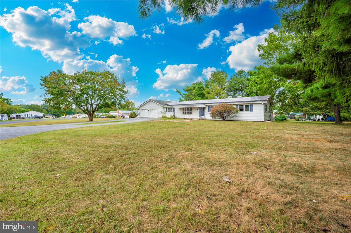 6 Schaller Lane Smithsburg, MD 21783 - Photo 4 of 51 a view of a swimming pool with an outdoor space and seating area