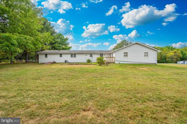 a view of a swimming pool with an outdoor space and seating area
