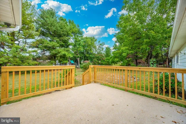 a view of balcony with wooden fence