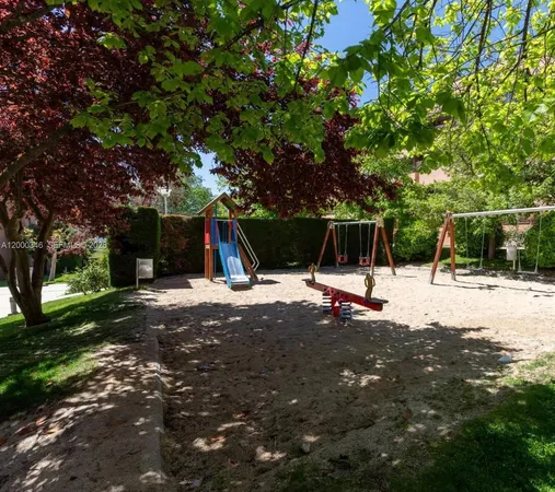 a view of a tree in front of a house