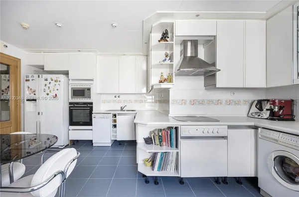 a kitchen with a stove and cabinets