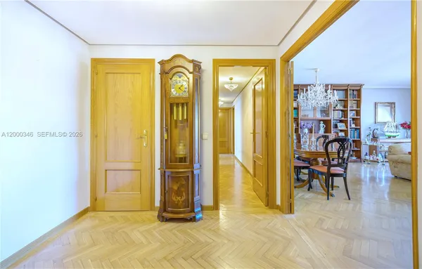 a view of a livingroom with furniture window and front door