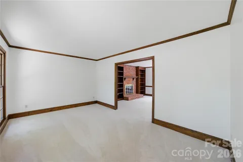 a view of an empty room with closet