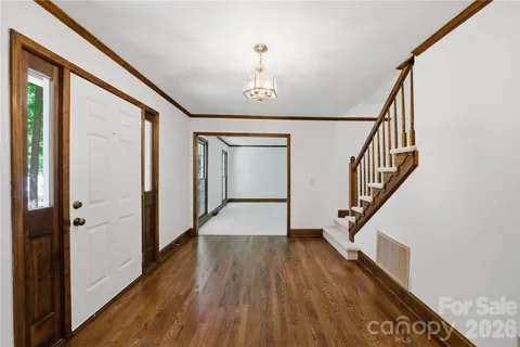 a view of entryway with wooden floor