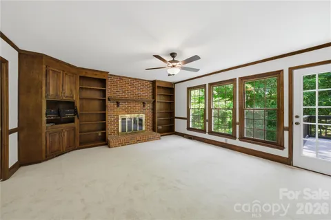 a view of a kitchen with a stove and a large window