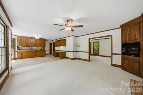 a view of livingroom with furniture and a ceiling fan