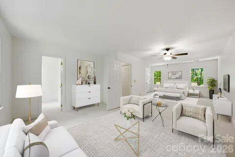 a living room with furniture and a lamp