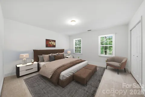 a bedroom with bed and a couch