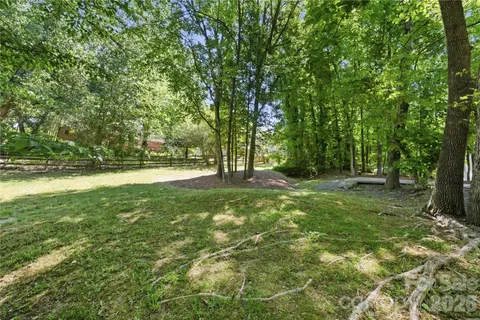 a view of outdoor space with trees all around