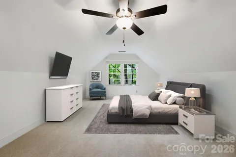 a bedroom with furniture and a window