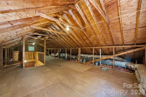 a view of a room with wooden walls