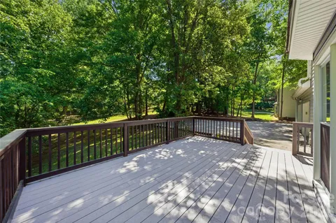 a view of deck and a backyard