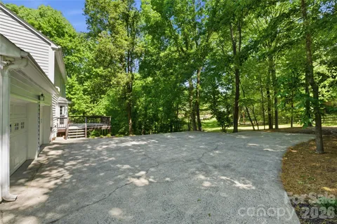 a view of a yard with a tree