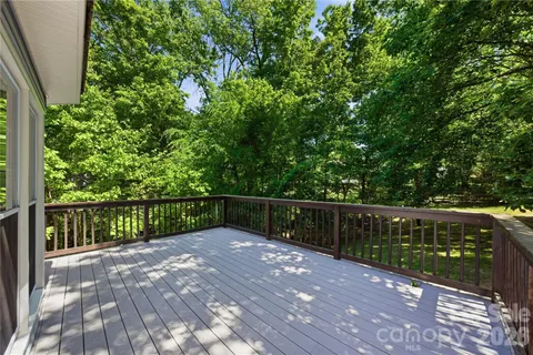 a balcony with trees in front of it