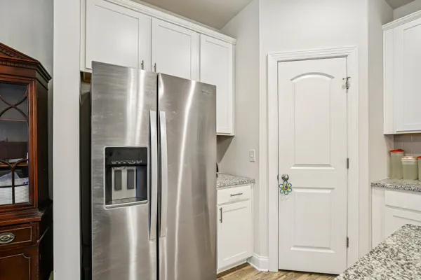 a refrigerator freezer sitting inside of a kitchen