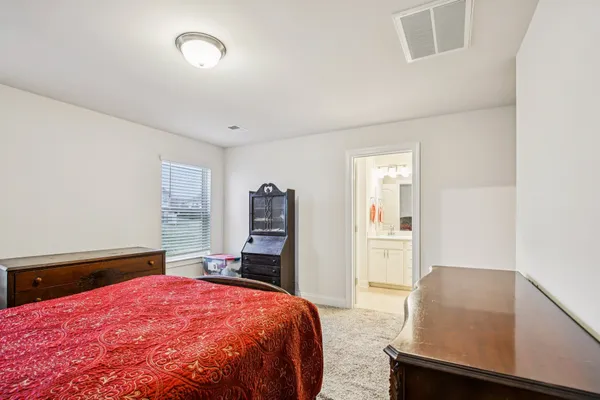 a bathroom with a sink vanity and a mirror