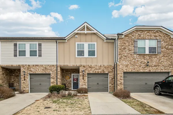 a front view of a house with yard