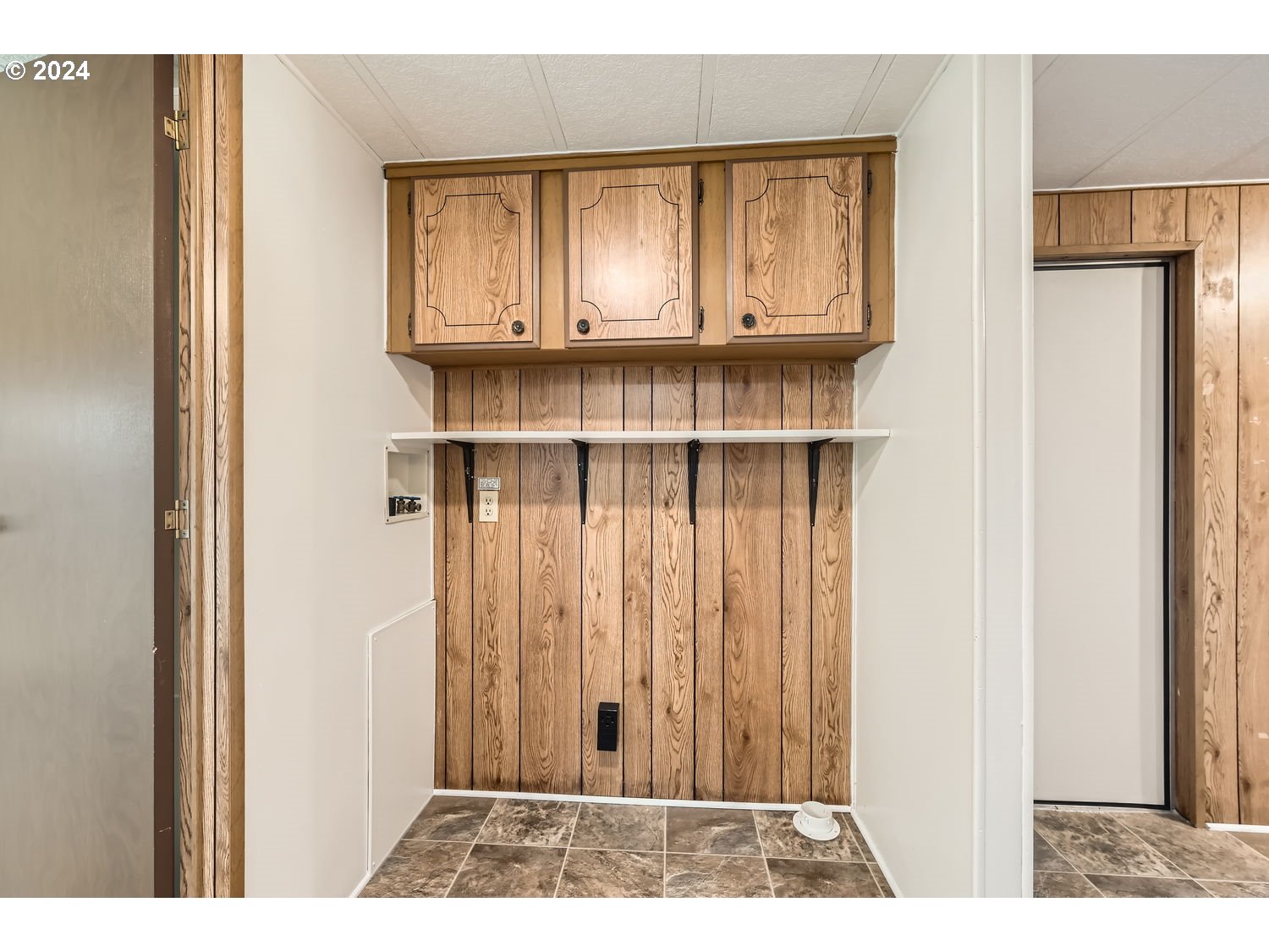 7227 Southeast Flavel Street, Unit 38 Portland, OR 97206 - Photo 11 of 14 a view of a wooden door