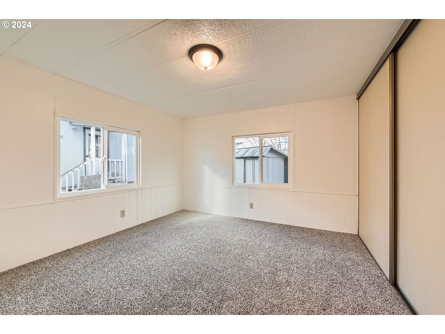 7227 Southeast Flavel Street, Unit 38 Portland, OR 97206 - Photo 10 of 14 a view of an empty room with a window