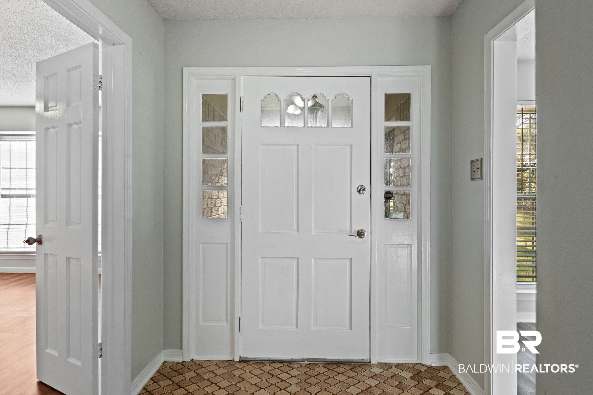 3864 Leroy Stevens Road Mobile, AL 36619 - Photo 4 of 33 Entryway with plenty of natural light and a textured ceiling