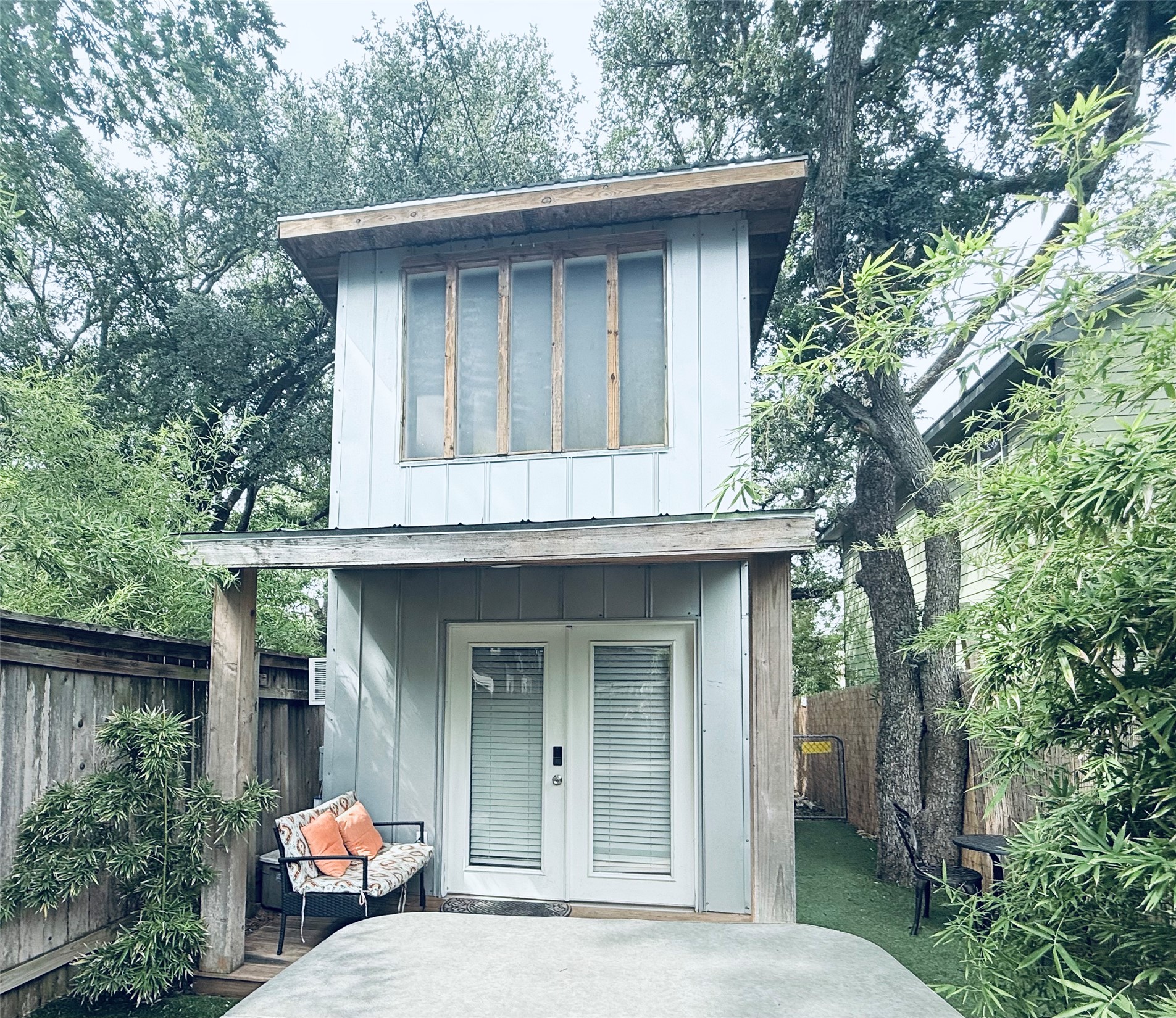 307 East 35th Street, Unit A Austin, TX 78705 - Photo 23 of 31 A charming backyard retreat features a two-story outbuilding and a relaxing spa.