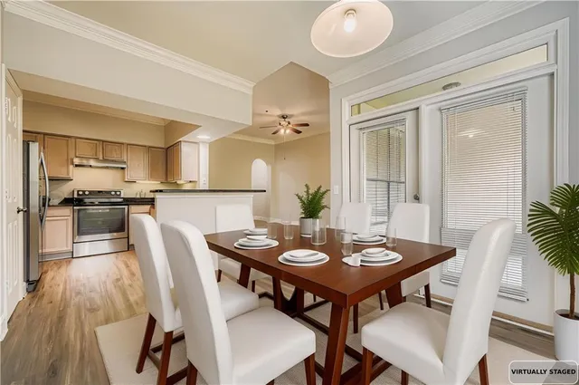 a view of a dining room with furniture and wooden floor