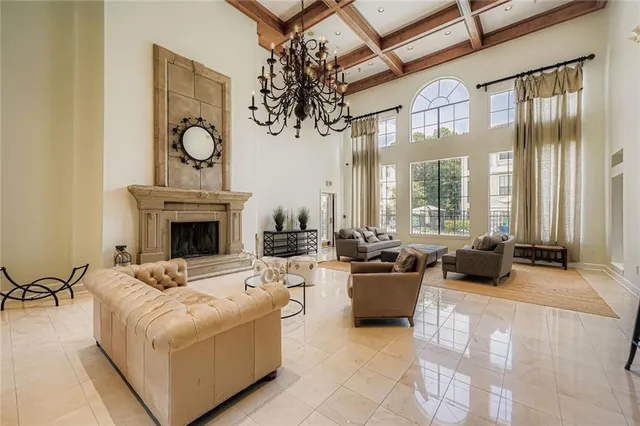 a living room with furniture fireplace and flat screen tv