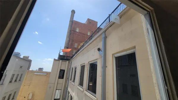a view of a chairs and tables in the patio